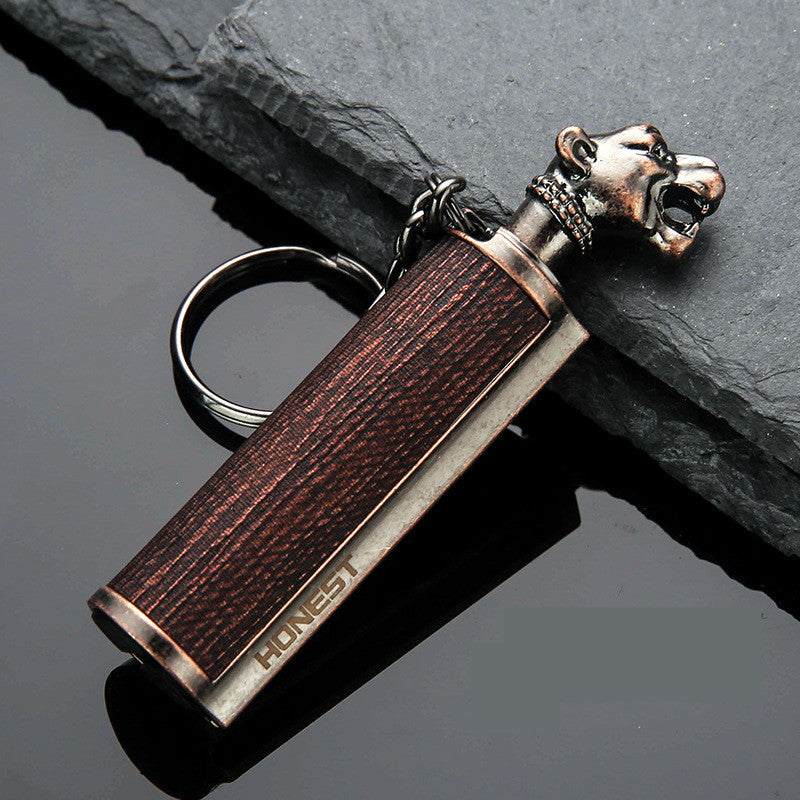 a key chain with a lion head on it