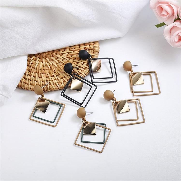a group of earrings on a table