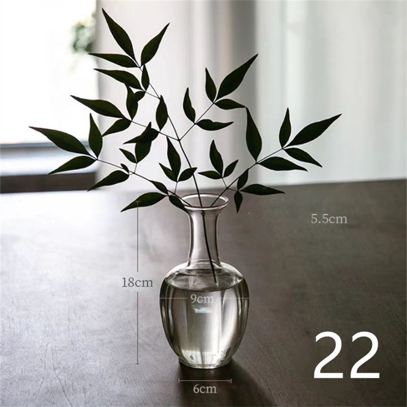 a vase with water and leaves