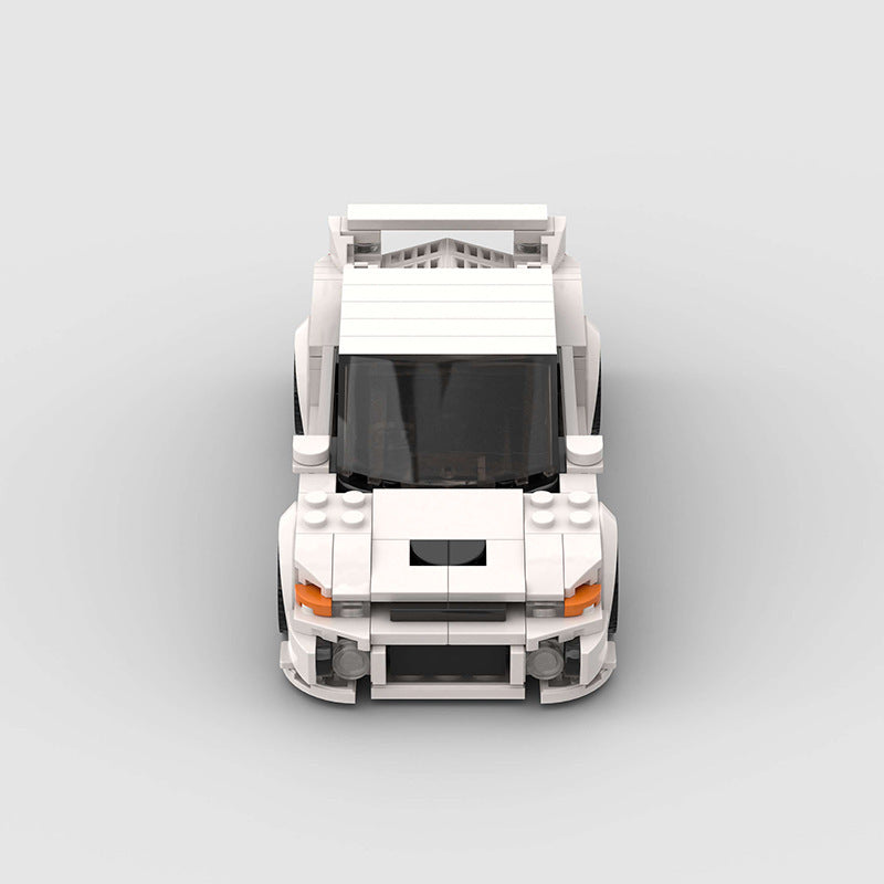 a white toy car with a black roof