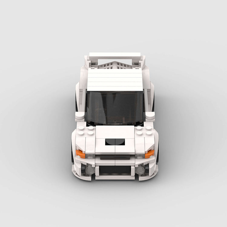 a white toy car with a black roof