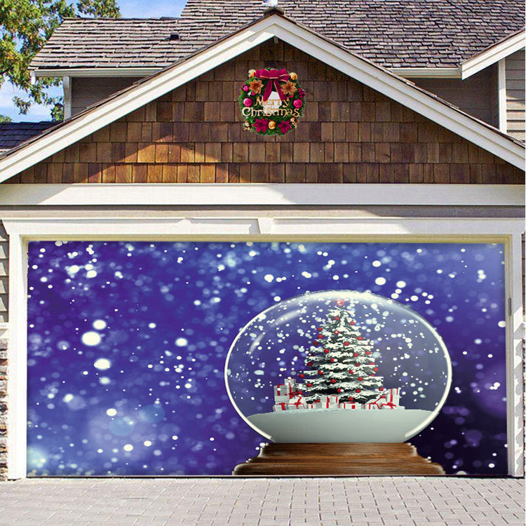a garage door with a snow globe and a christmas tree
