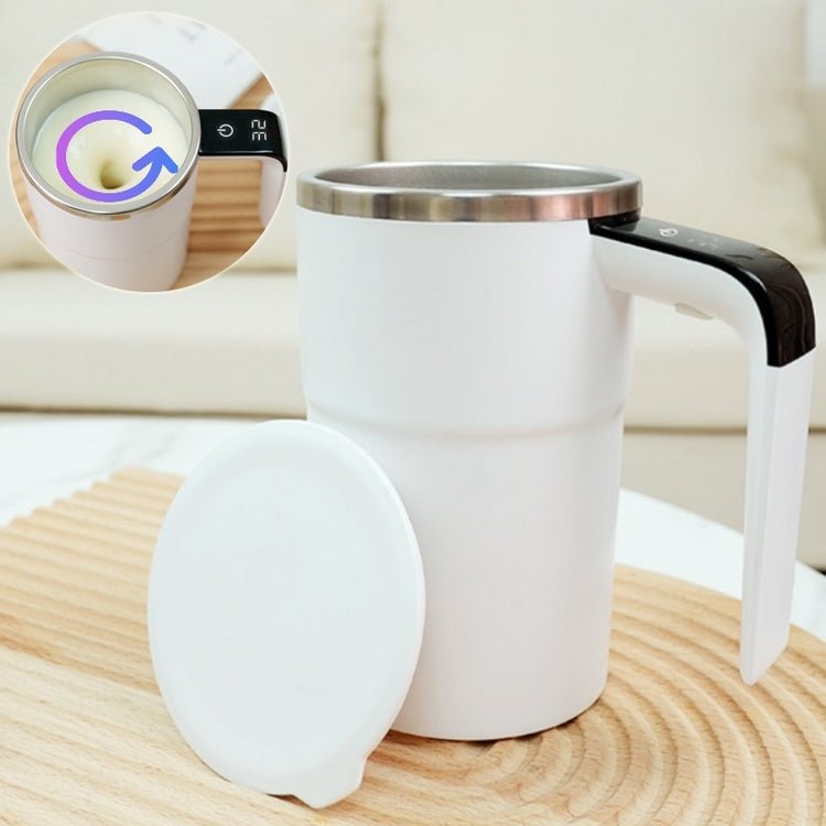 a white mug with a lid and a lid on a wood surface