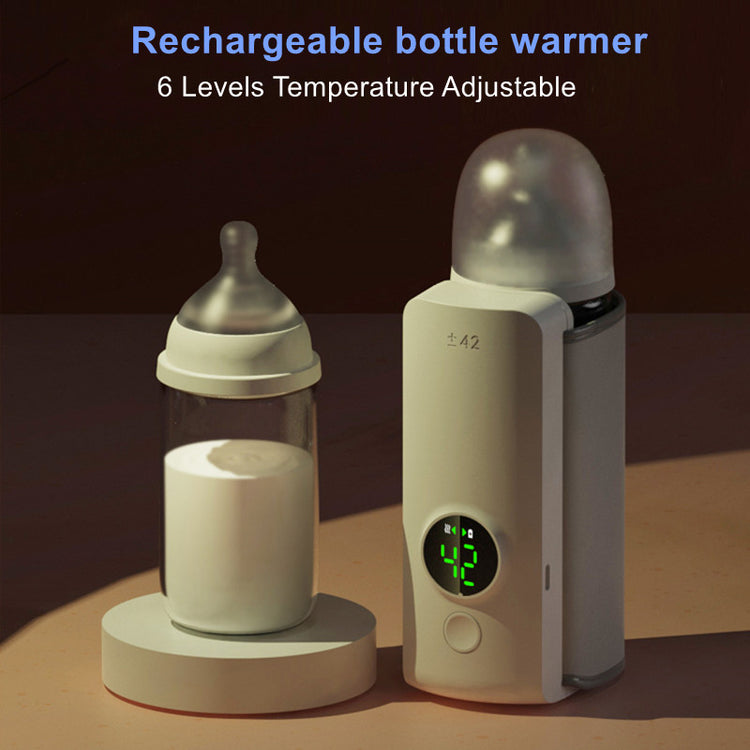 a baby bottle warmer and a baby bottle