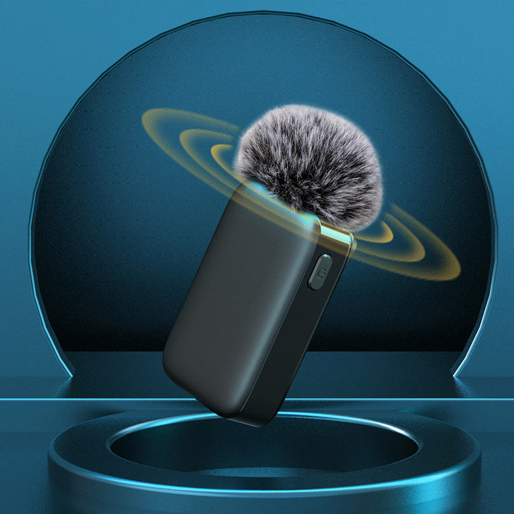 a black device with a fluffy ball in the air