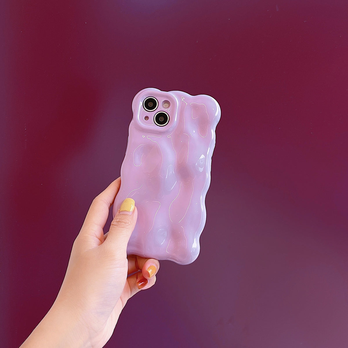 a hand holding a phone