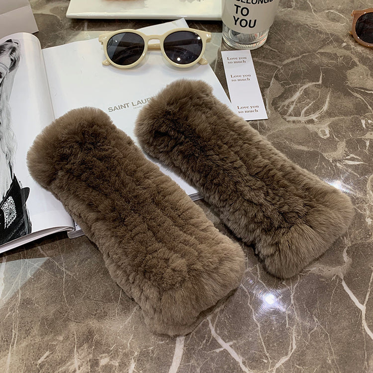 a pair of fur cases on a marble table