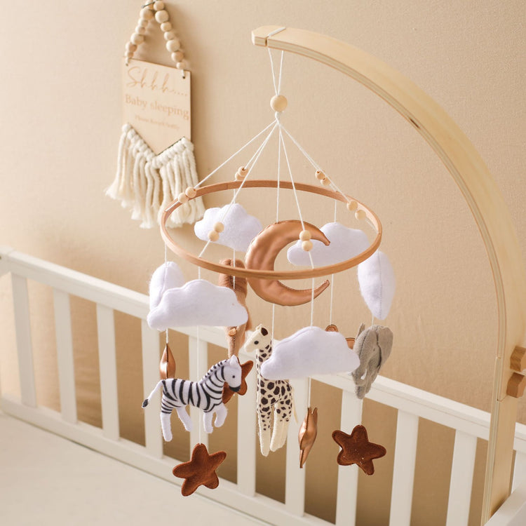 a mobile with animals and stars from a crib