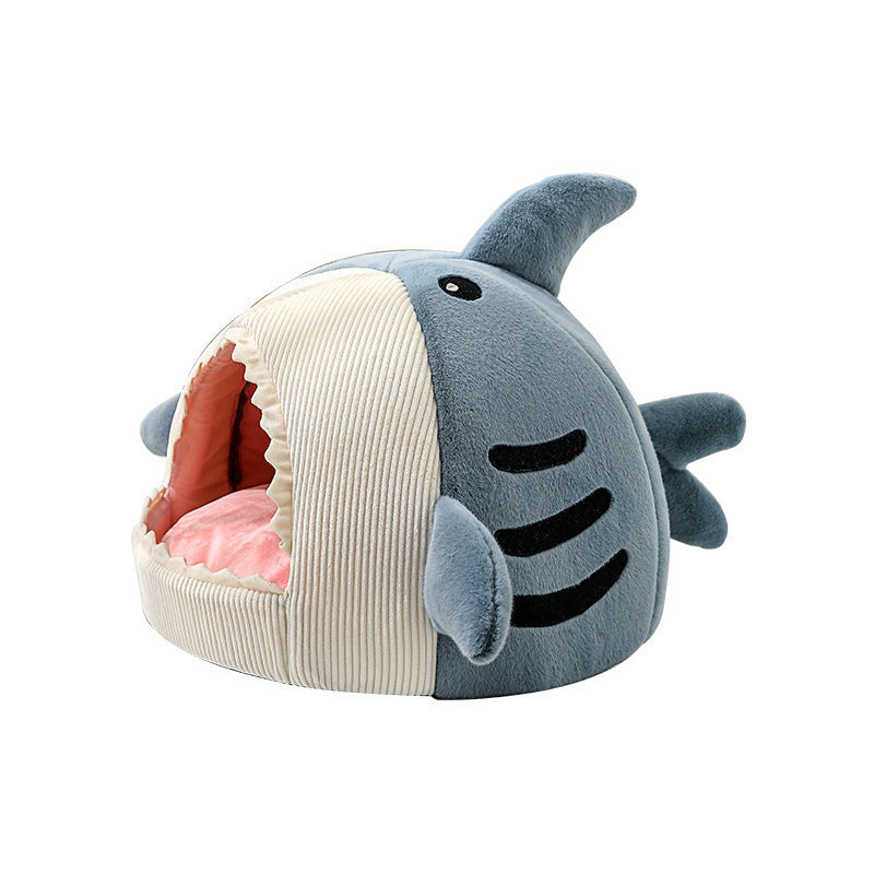 a stuffed animal shark with mouth open
