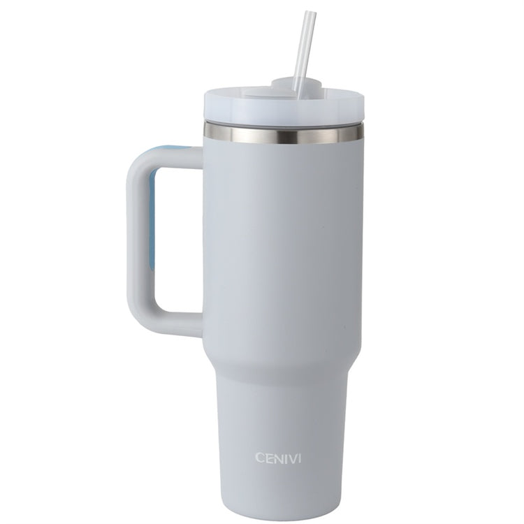 a white mug with a straw