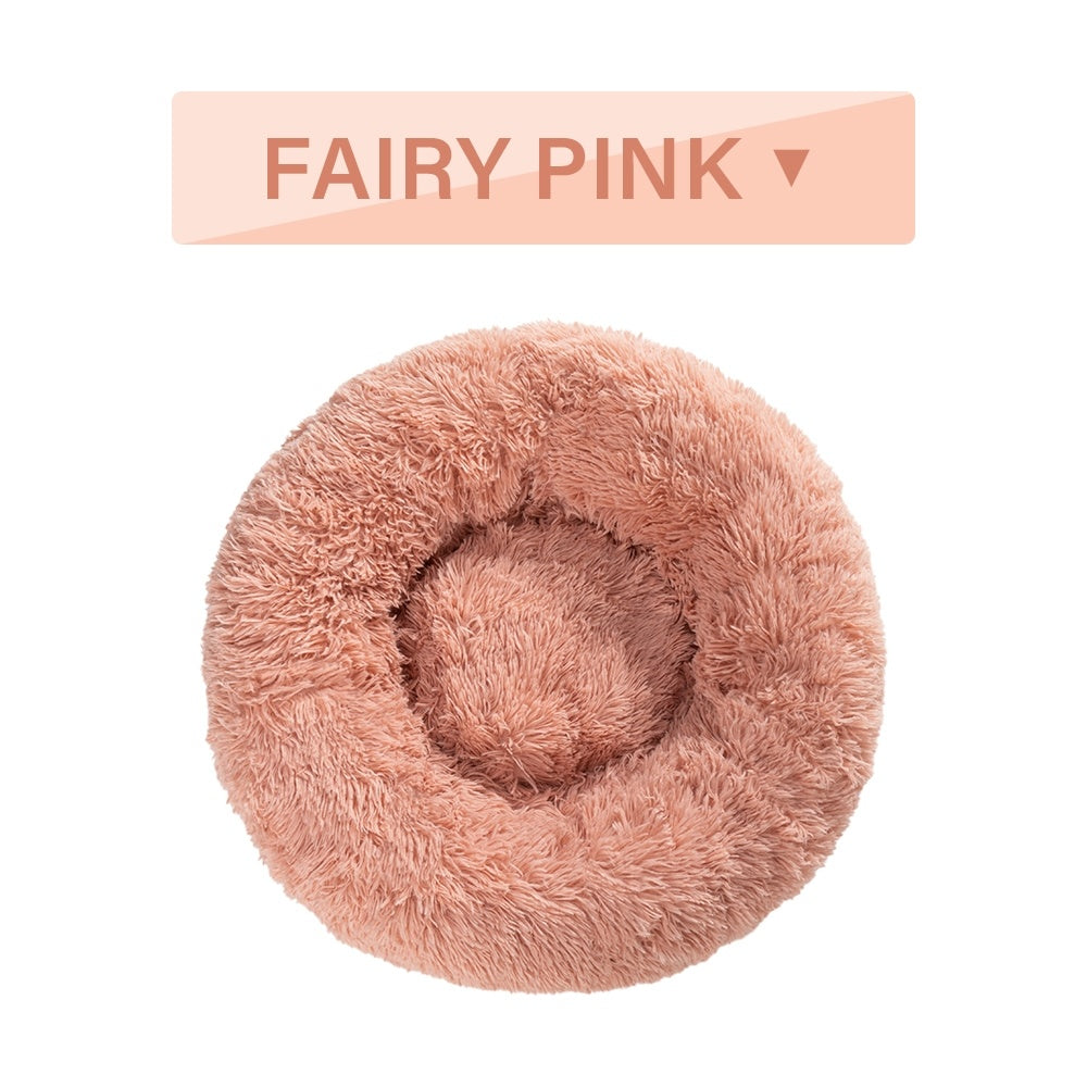 a pink fluffy pillow with text above