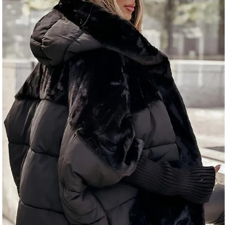 a woman wearing a black coat