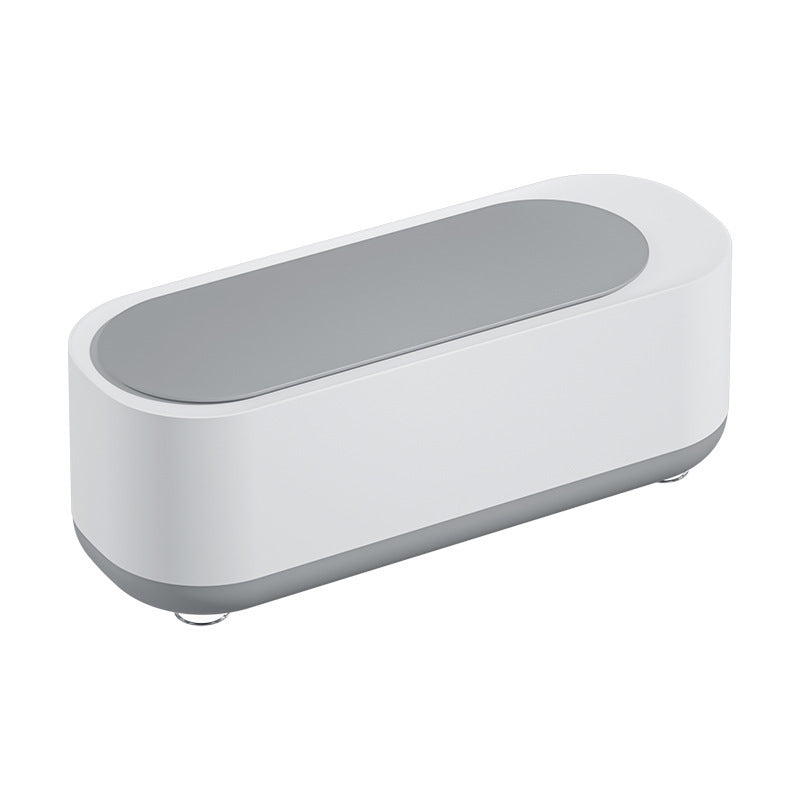 a white rectangular object with a grey lid
