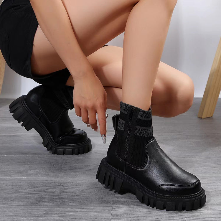 a person wearing black boots