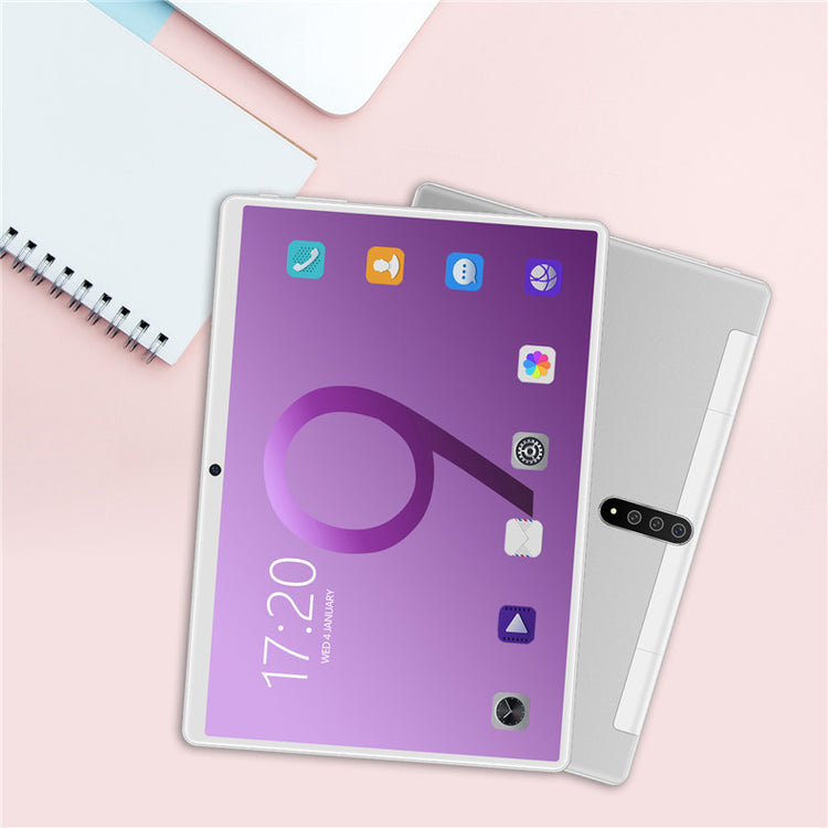 a tablet and notebook on a table