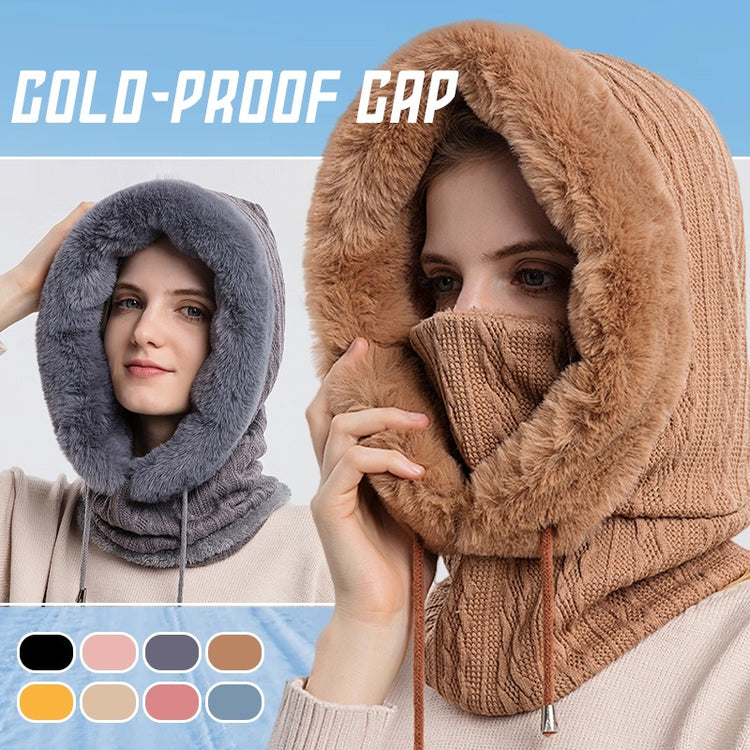 a woman wearing a hood and a scarf