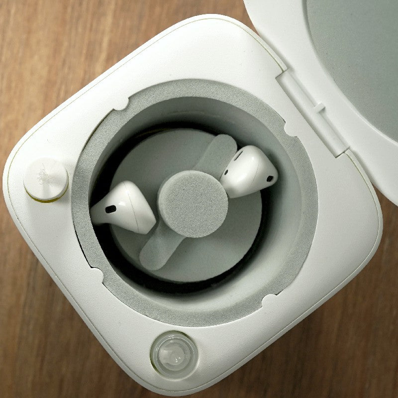 a white box with a white object with a lid open