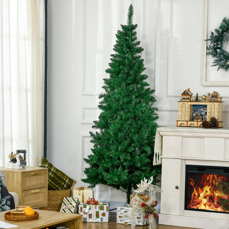 a christmas tree in a room with a fireplace and a wreath