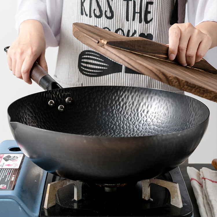 a person cooking on a stove