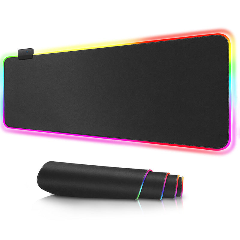 a black mouse pad with rainbow colored edges