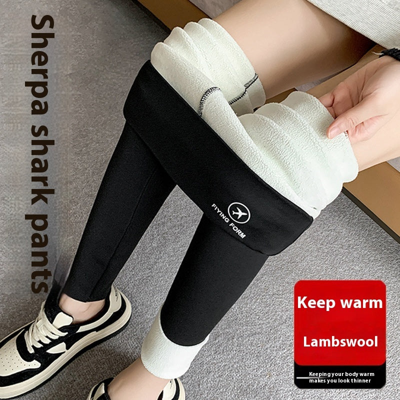 a person wearing leggings and shoes