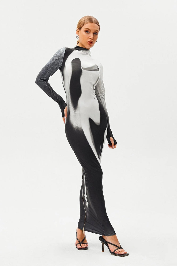 a woman in a black and white dress