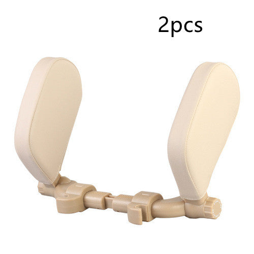 a pair of white plastic headrests