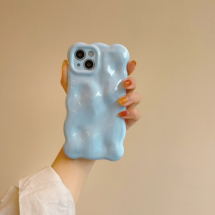 a hand holding a phone case