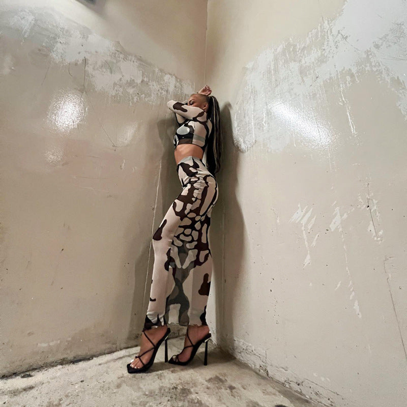 a woman leaning against a wall