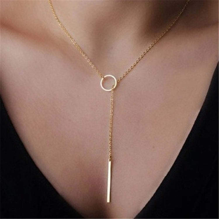 a person wearing a gold necklace