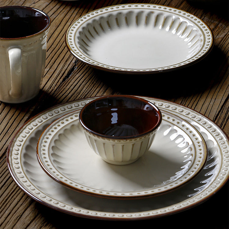 a group of plates and cups on a table