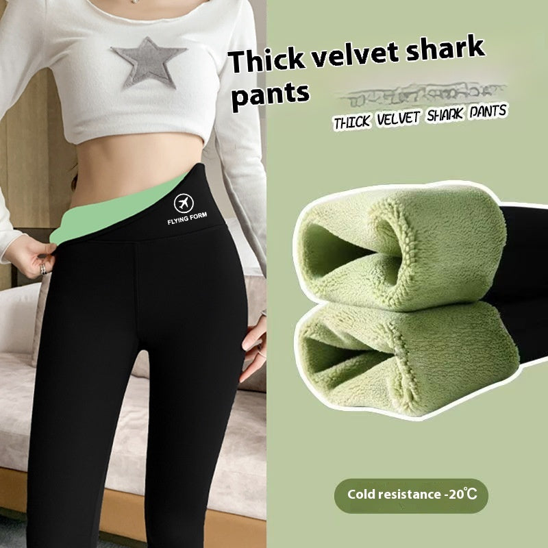 a woman wearing black pants