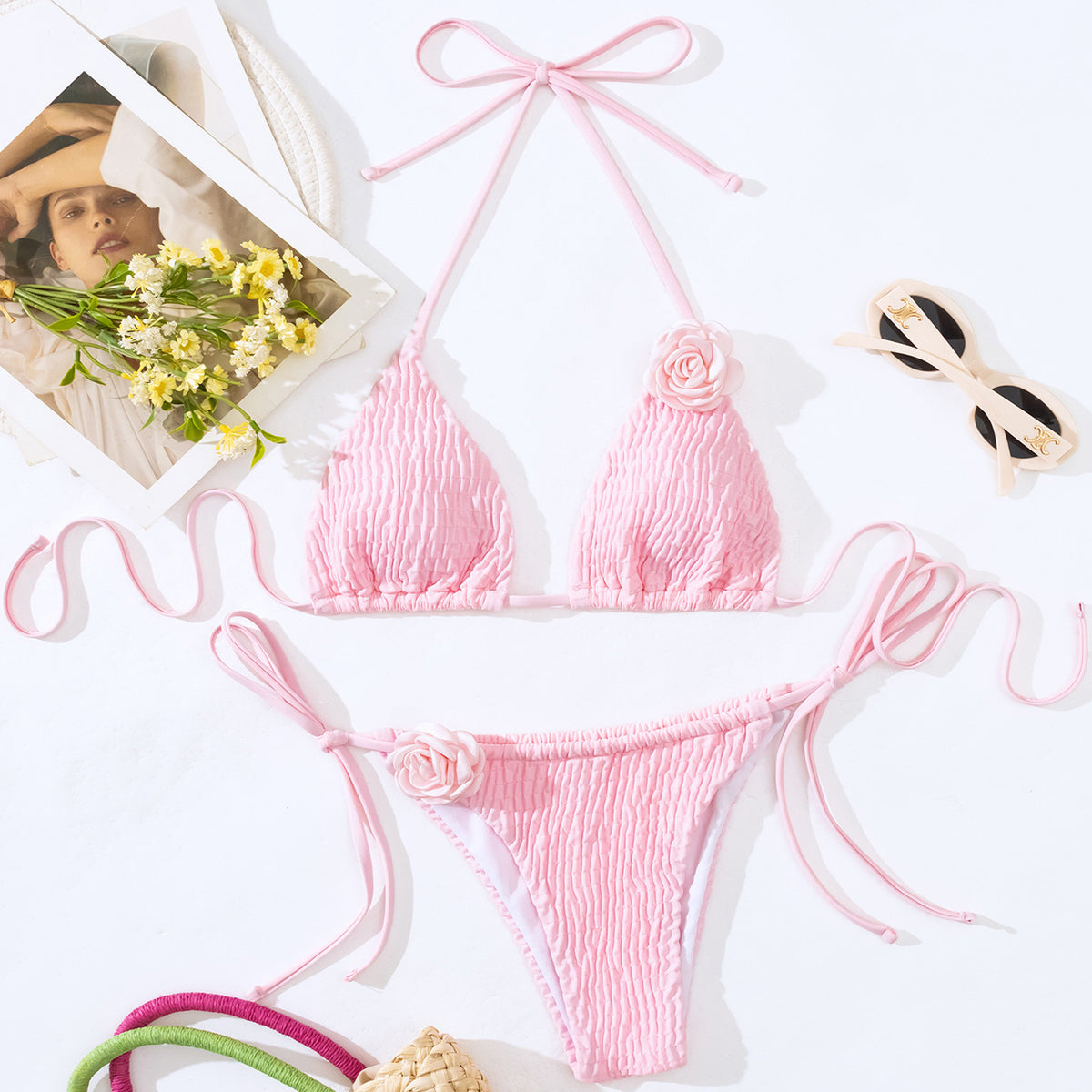 a pink garment and sunglasses