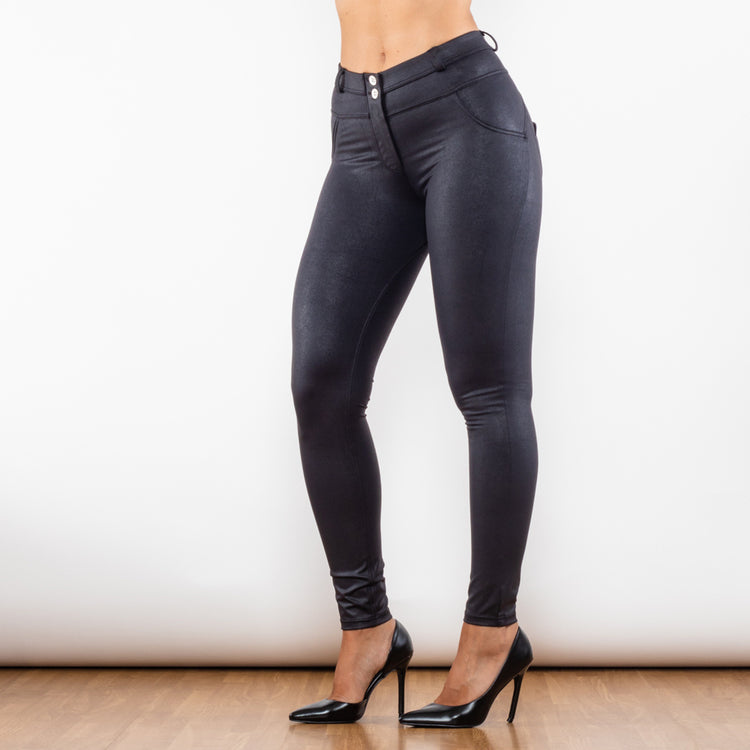 a woman wearing black pants