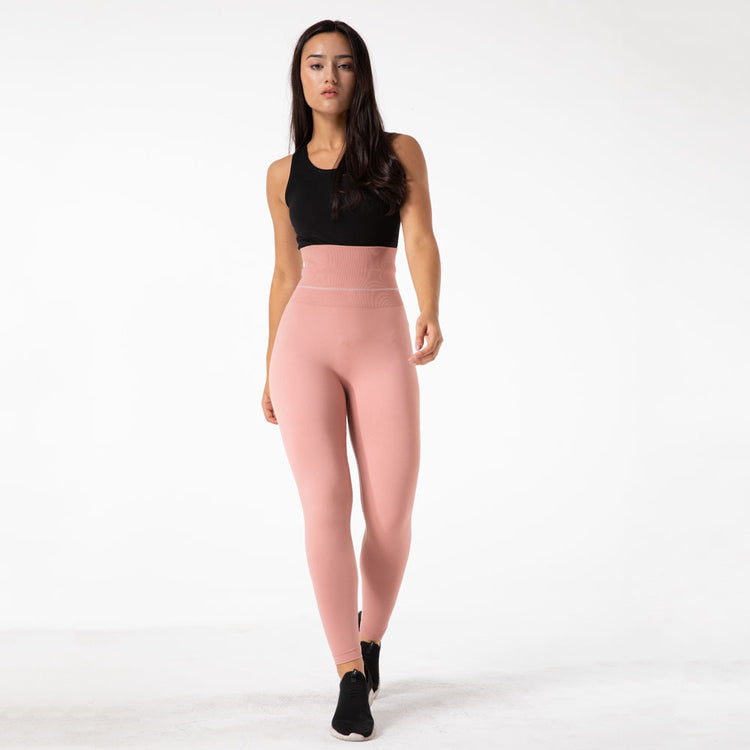a woman in pink pants