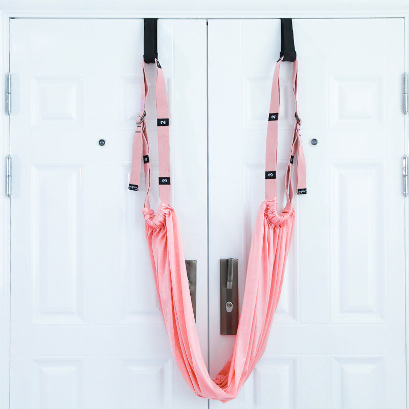 a pair of pink hammocks on a white door