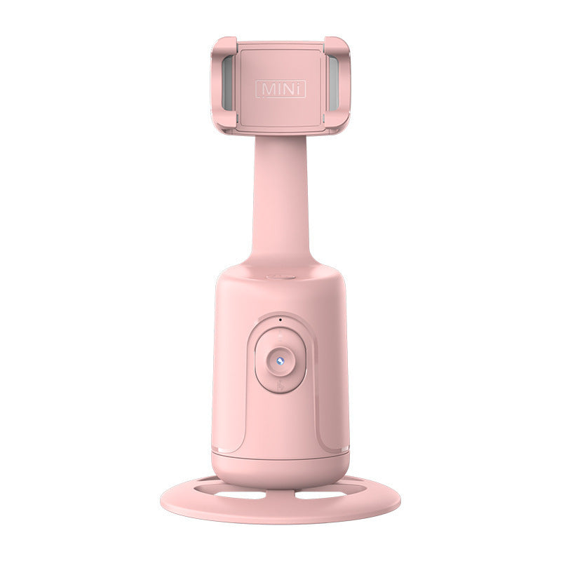 a pink object with a round base