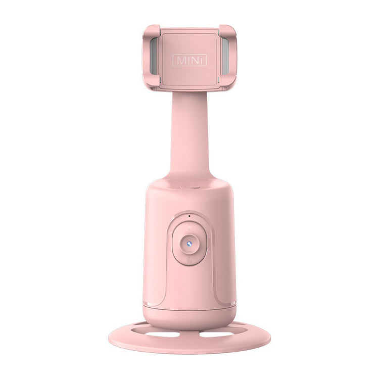 a pink object with a round base
