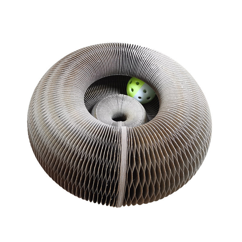 a cardboard spiral with a green and yellow dice inside