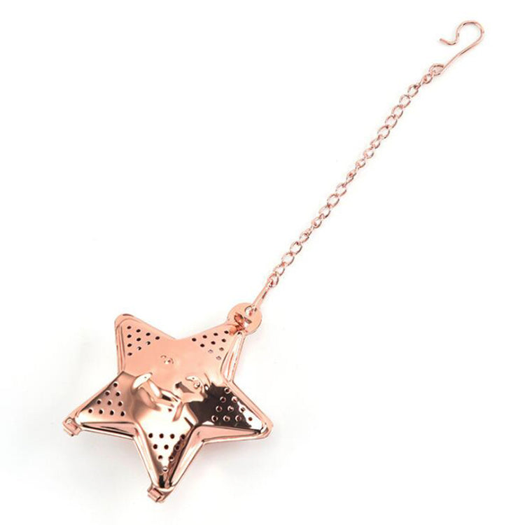 a gold star shaped tea strainer