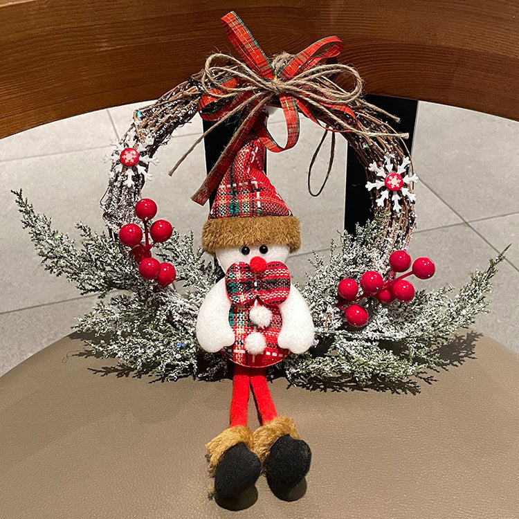 a christmas wreath with a snowman on it