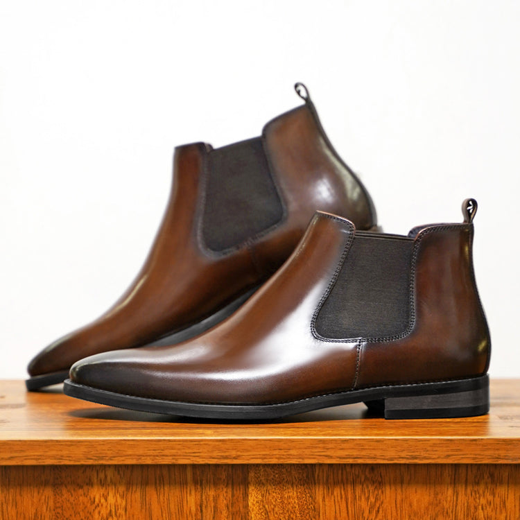 a pair of brown leather shoes