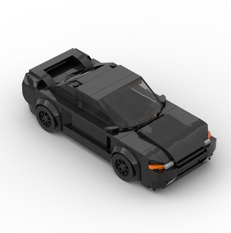 a black toy car on a white background
