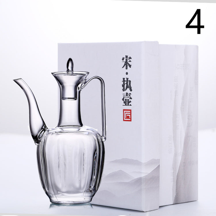 a glass container next to a box