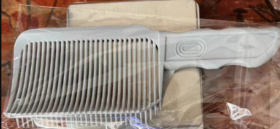 a white comb in a plastic bag