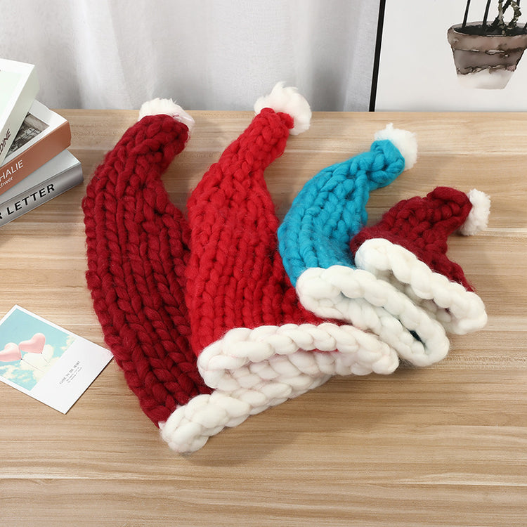 a group of knit hats on a table