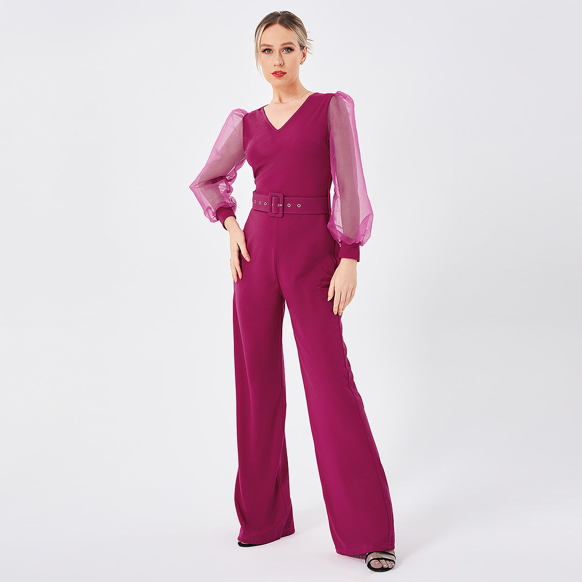 a woman in a pink jumpsuit