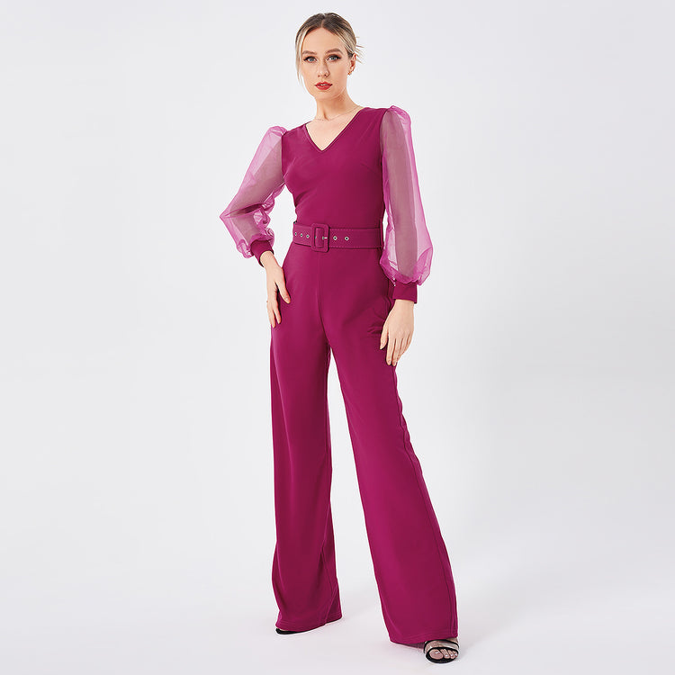 a woman in a pink jumpsuit