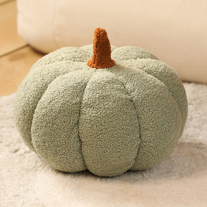 a green pumpkin on a carpet