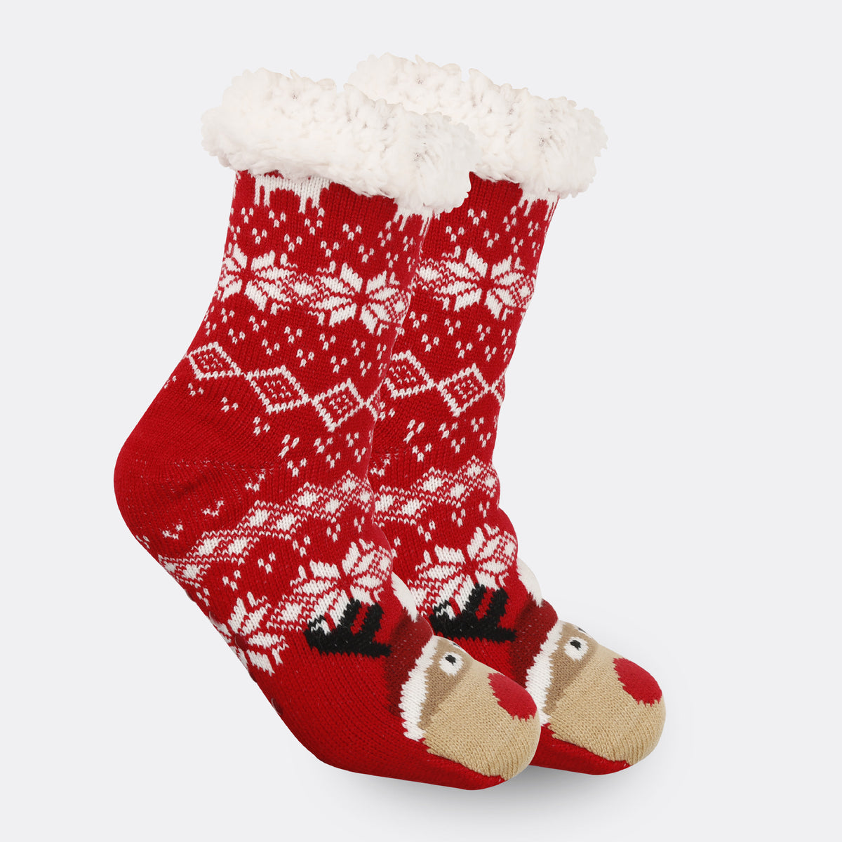 a pair of red and white socks with reindeer design